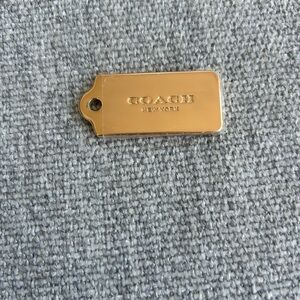 Coach rose Gold Tag